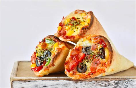 Pizza cone - About Us. Wow, it’s a Pizza in a Cone, a unique and one of its kind concept pizza in India. Conopizza is well prepared to serve hot and fresh Cono pizza’s to the pizza lovers all around with a concept of “JUNK YET HEALTHY”, we serve Pizza ingredients stuffed in a thin crust cone (pizza base) made out of the finest wheat and common floor ...
